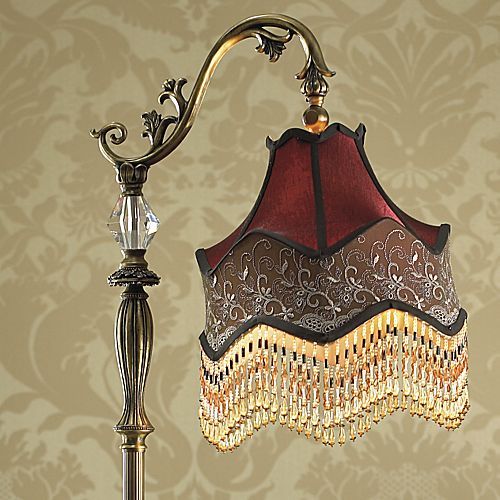 Floor Lamp metal/polyresin base features ornate carvings and a 