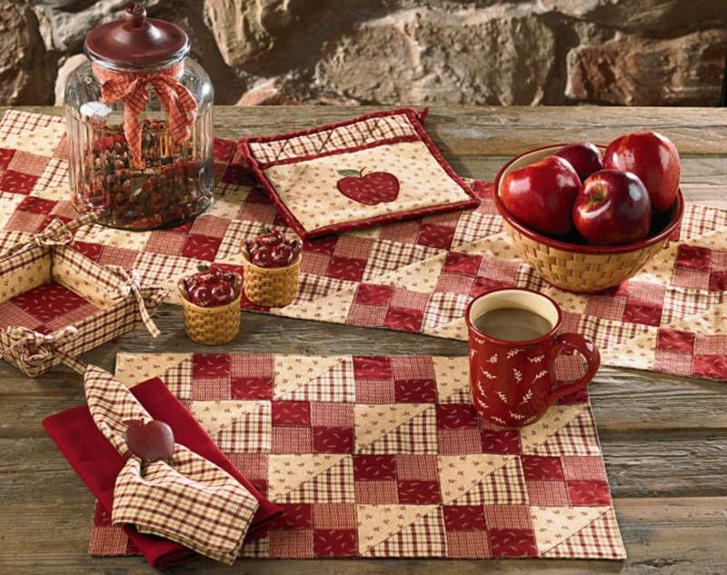 Apple Jack features four patterns in shades of red, wine and vanilla,