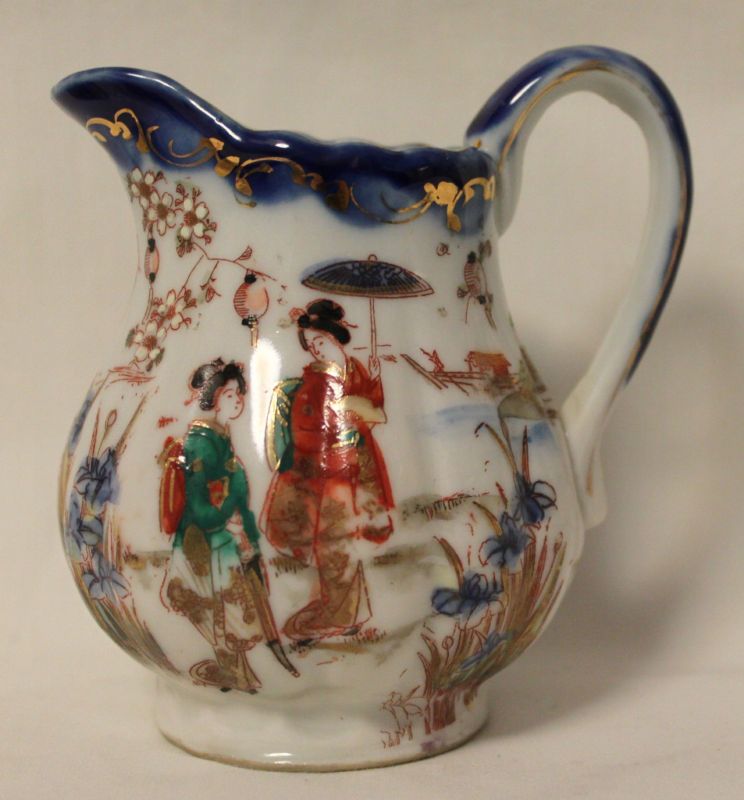 Asian design figural pitcher/creamer  