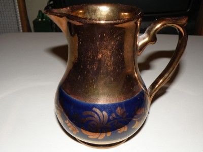 Beautiful Copper Lusterware pitcher with cobalt accents  